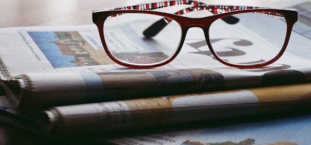 Glasses on newspapers